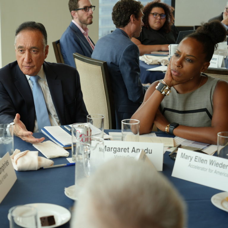 Teamwork taking place at a round table