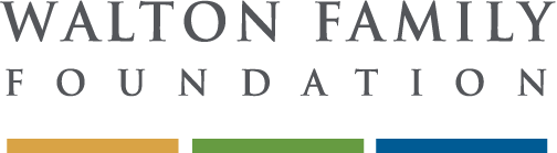 A logo with the words SHELTON FAMILY FOUNDATION spelled out in uppercase letters, featuring a color block design with different shades reflecting beneath the text.